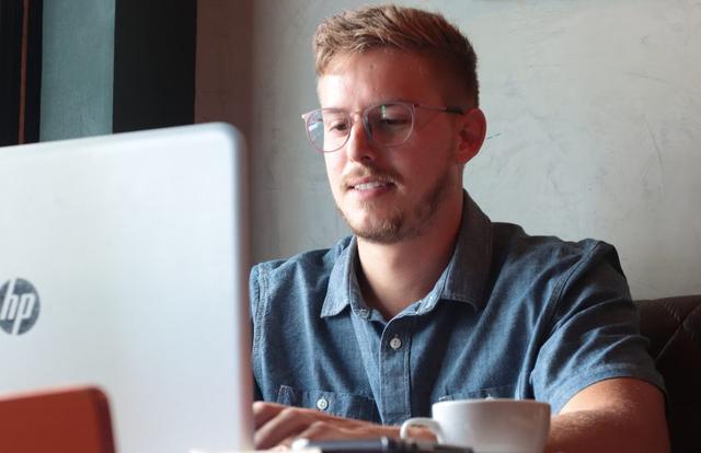 man working on his computer