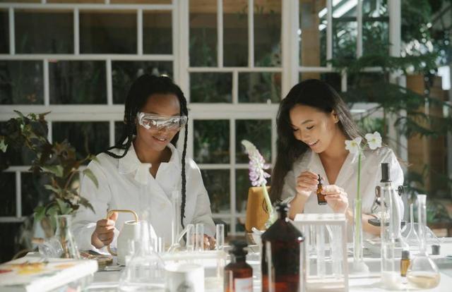 scientists working with test tubes and flowers