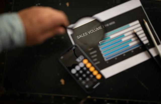 Sales volume highlighted in a magnifying glass