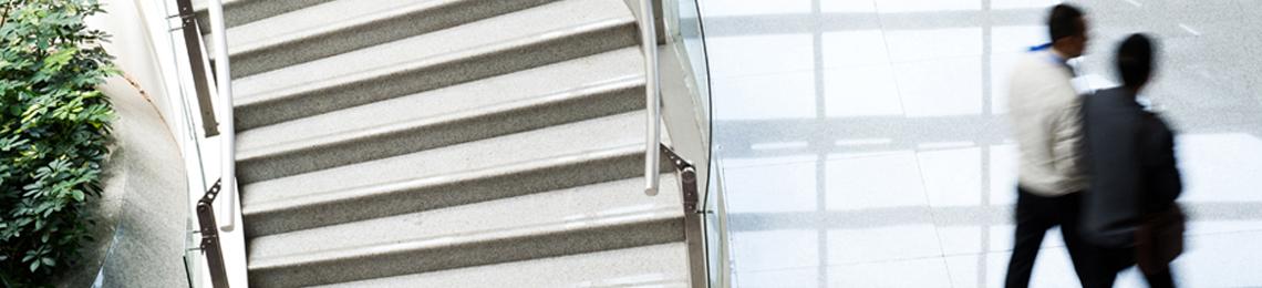 people walking near a staircase